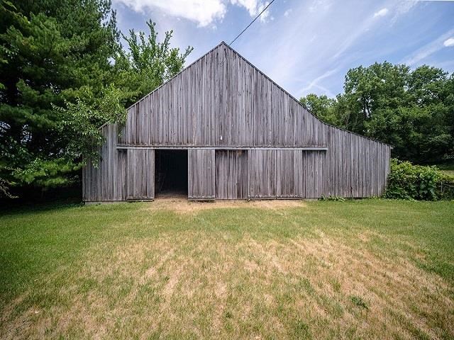 4909 West Edgewood Road Dixon, IL 61021 - Photo 48 of 96 a view of a backyard with large trees and wooden fence