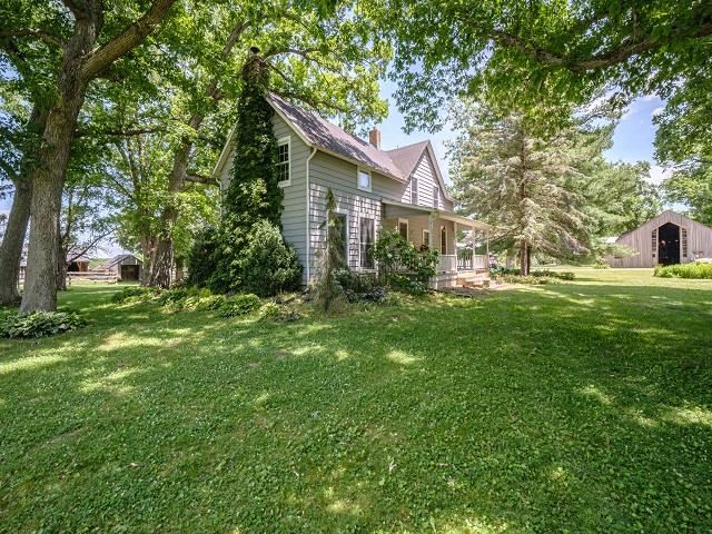 4909 West Edgewood Road Dixon, IL 61021 - Photo 52 of 96 a front view of a house with garden