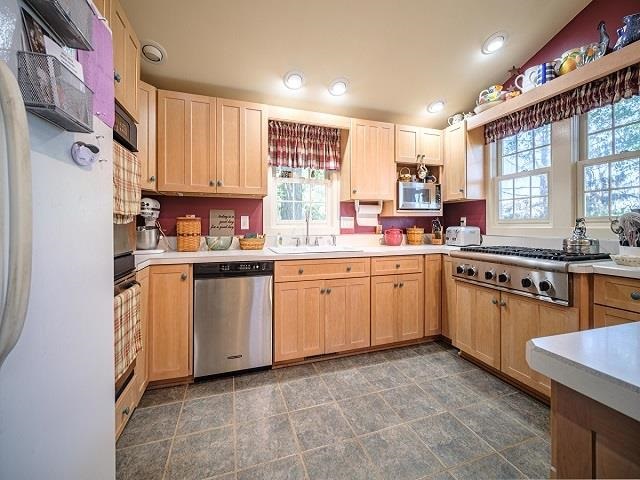 4909 West Edgewood Road Dixon, IL 61021 - Photo 56 of 96 a kitchen with a sink stove and cabinets