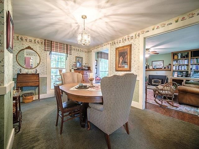 4909 West Edgewood Road Dixon, IL 61021 - Photo 64 of 96 a view of a dining room with furniture window and wooden floor