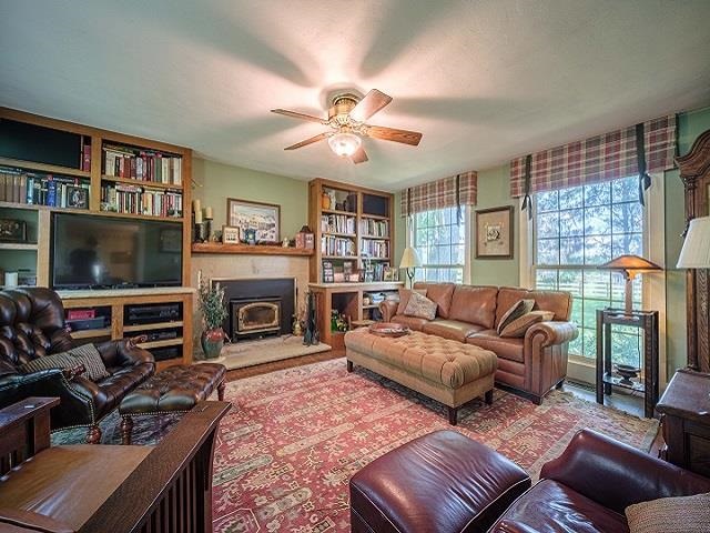 4909 West Edgewood Road Dixon, IL 61021 - Photo 68 of 96 a living room with furniture a flat screen tv and a fireplace