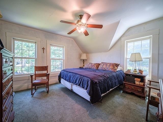 4909 West Edgewood Road Dixon, IL 61021 - Photo 73 of 96 a spacious bedroom with a bed and a chandelier