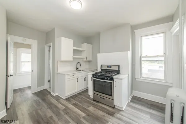 a kitchen with a stove and a sink