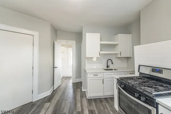 a kitchen with a stove and a sink