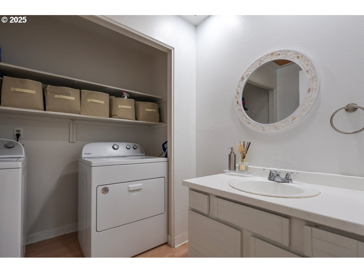 7824 Northeast Loowit Loop, Unit 70 Vancouver, WA 98662 - Photo 4 of 26 a bathroom with a sink and a mirror