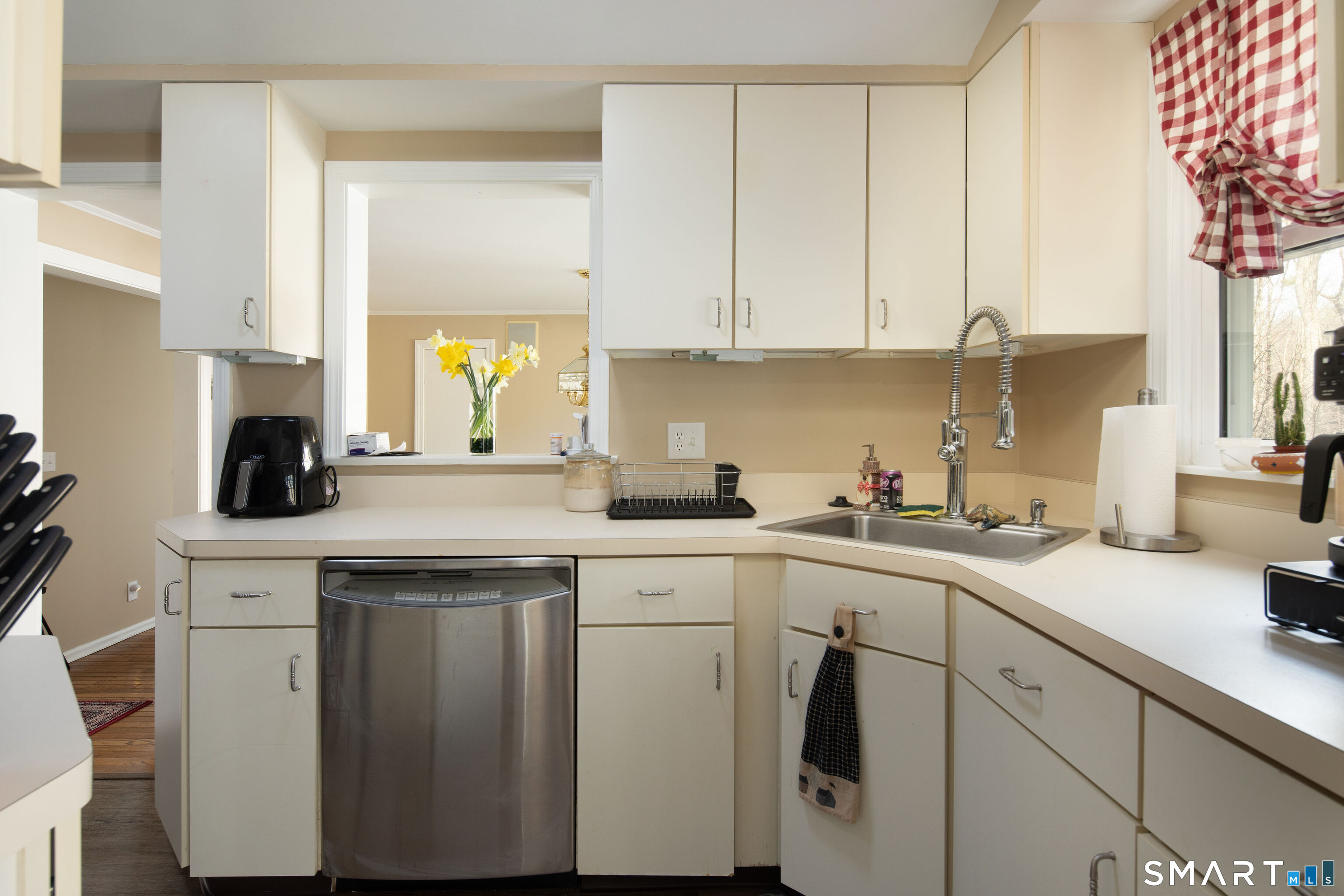 255 Dibble Hill Road Cornwall, CT 06796 - Photo 22 of 30 a kitchen with white cabinets and white appliances