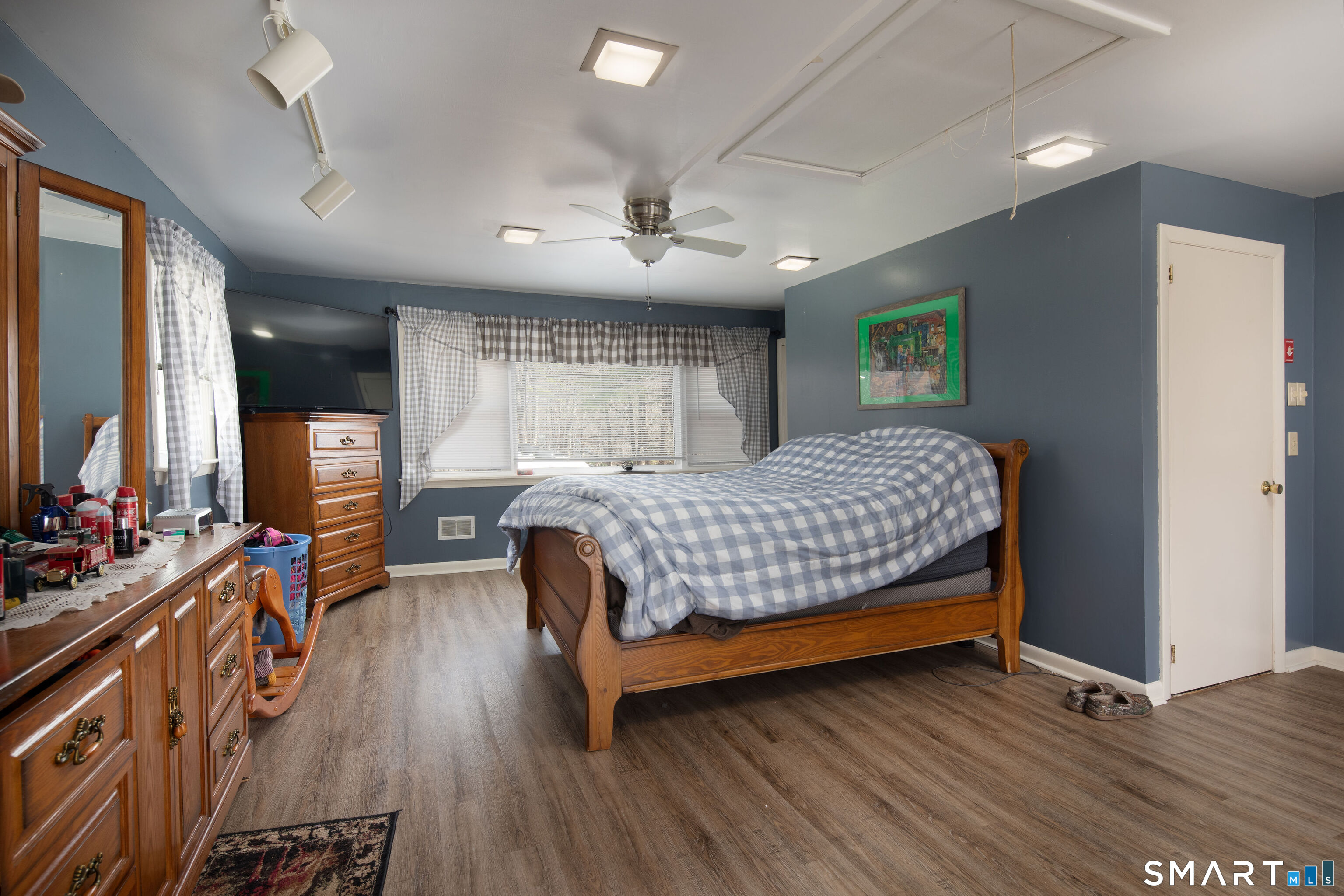 255 Dibble Hill Road Cornwall, CT 06796 - Photo 29 of 30 a bedroom with a bed and wooden floor