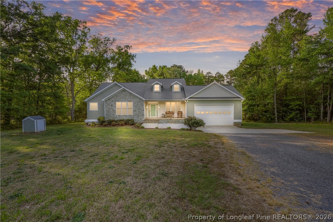 280 Hemp St Extension Robbins, NC 27325 - Photo 1 of 29 a front view of a house with garden
