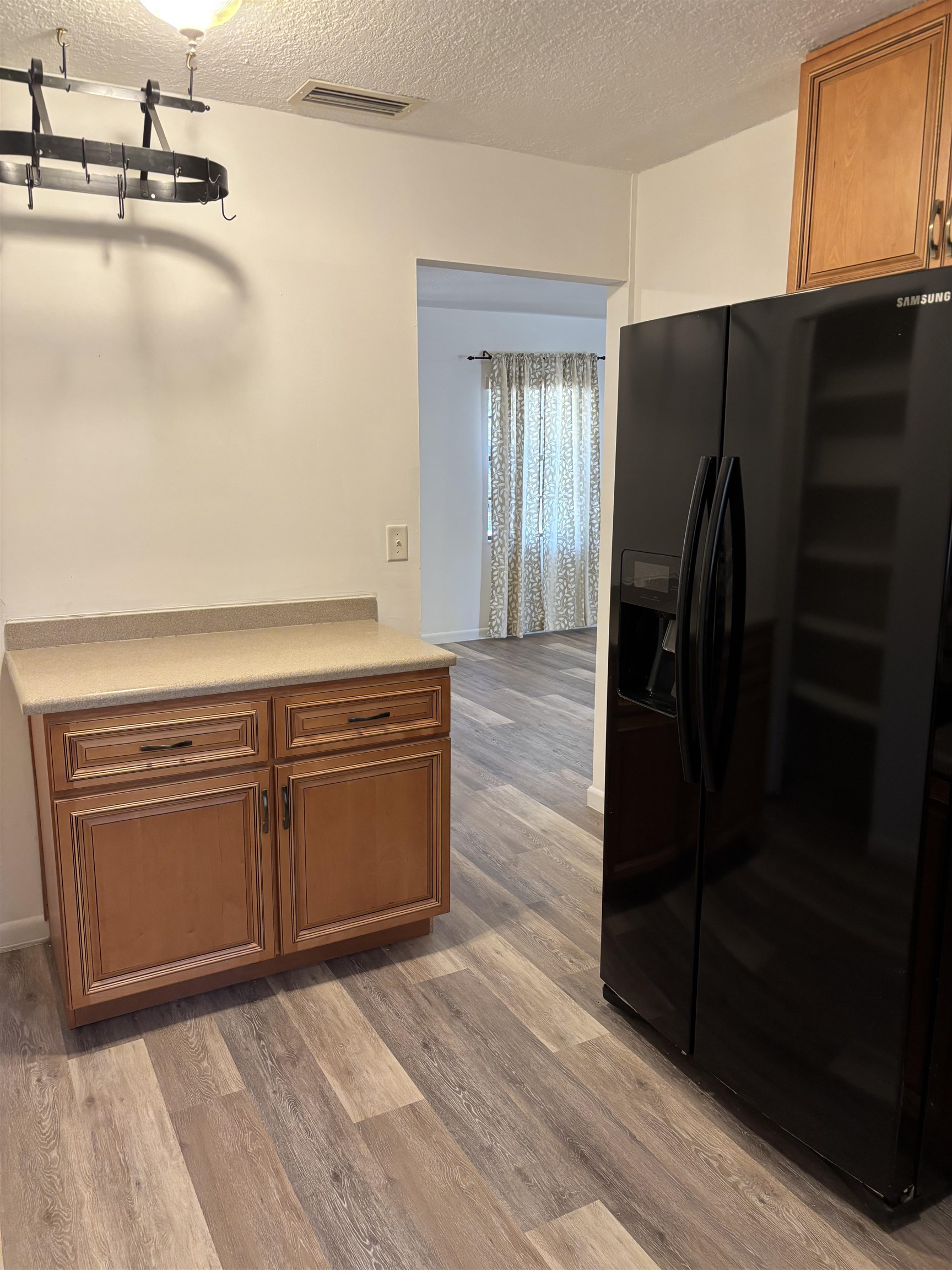 3421 Red Cloud Trail St. Augustine, FL 32086 - Photo 14 of 19 a kitchen with a refrigerator and cabinets