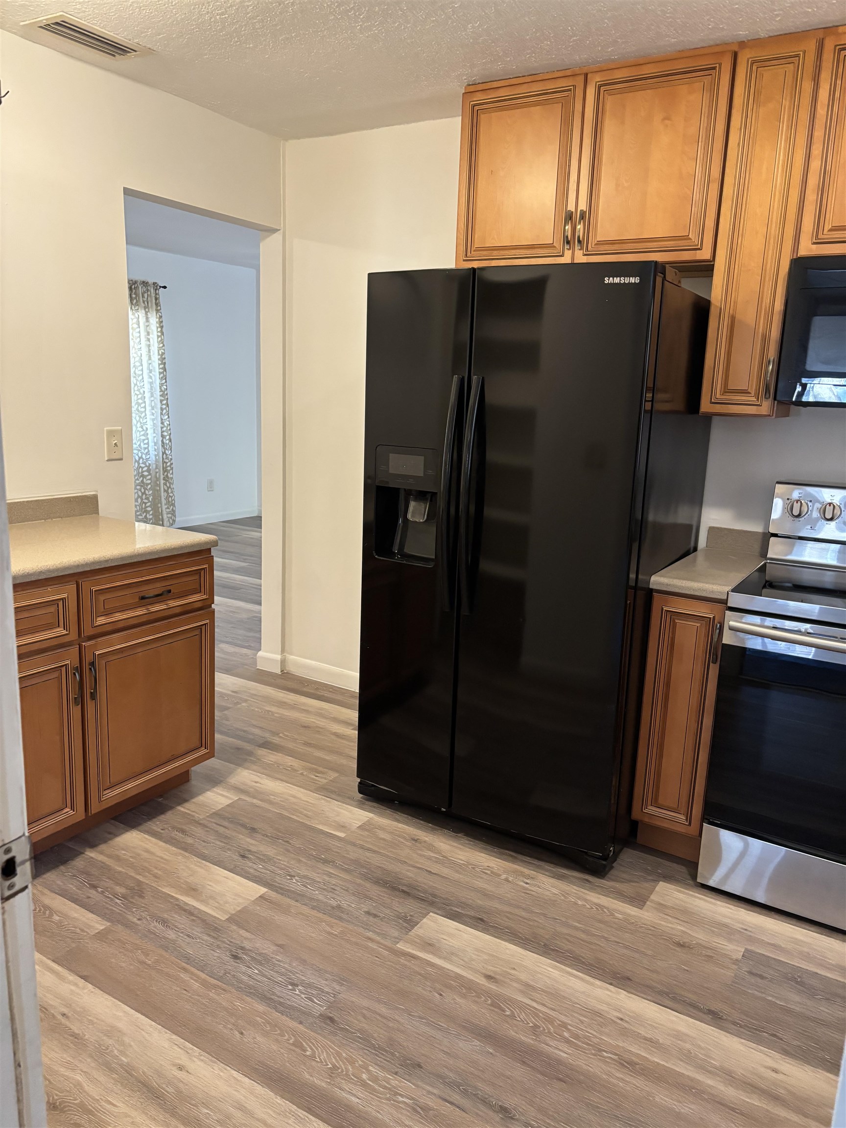 3421 Red Cloud Trail St. Augustine, FL 32086 - Photo 15 of 19 a kitchen with stainless steel appliances granite countertop a refrigerator and a sink