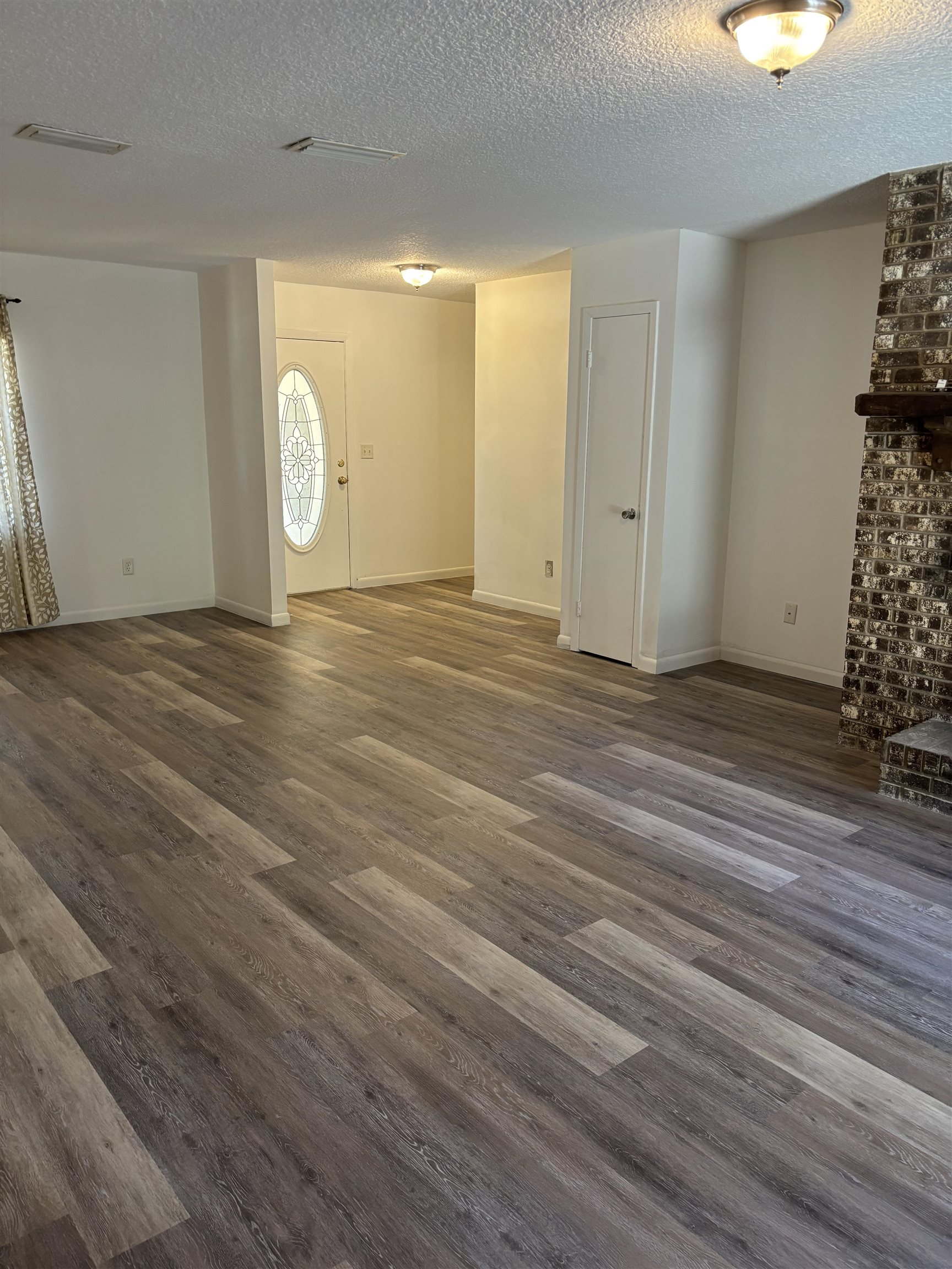 3421 Red Cloud Trail St. Augustine, FL 32086 - Photo 3 of 19 an empty room with wooden floor and windows