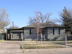 4365 South Tyler Street Amarillo, TX 79110 - Photo 1 of 6 a front view of a house with garden