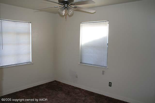 4365 South Tyler Street Amarillo, TX 79110 - Photo 5 of 6 an empty room with a window