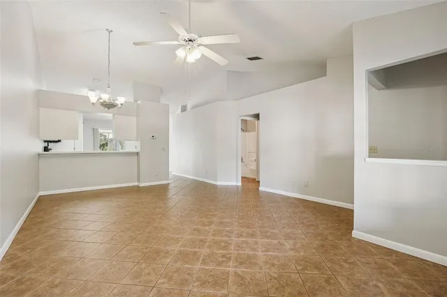 a view of a kitchen with a sink and a chandelier