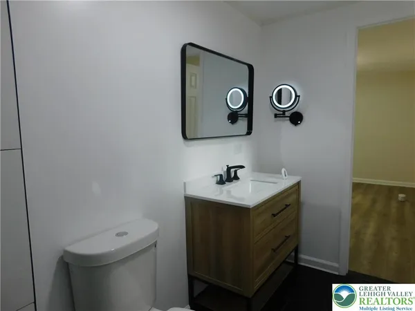 a bathroom with a shower and a sink