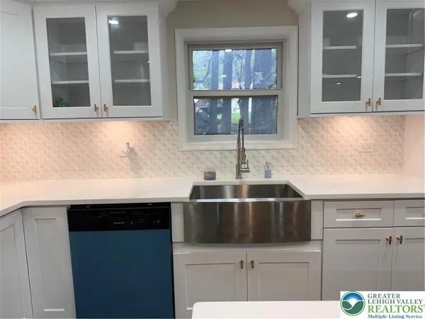 a kitchen with a sink and cabinets
