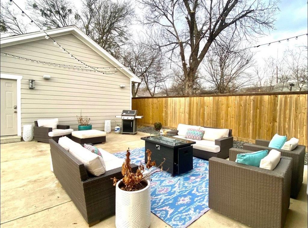 3526 Ivandell Avenue Dallas, TX 75211 - Photo 12 of 17 a view of a patio with couches chairs and a fire pit