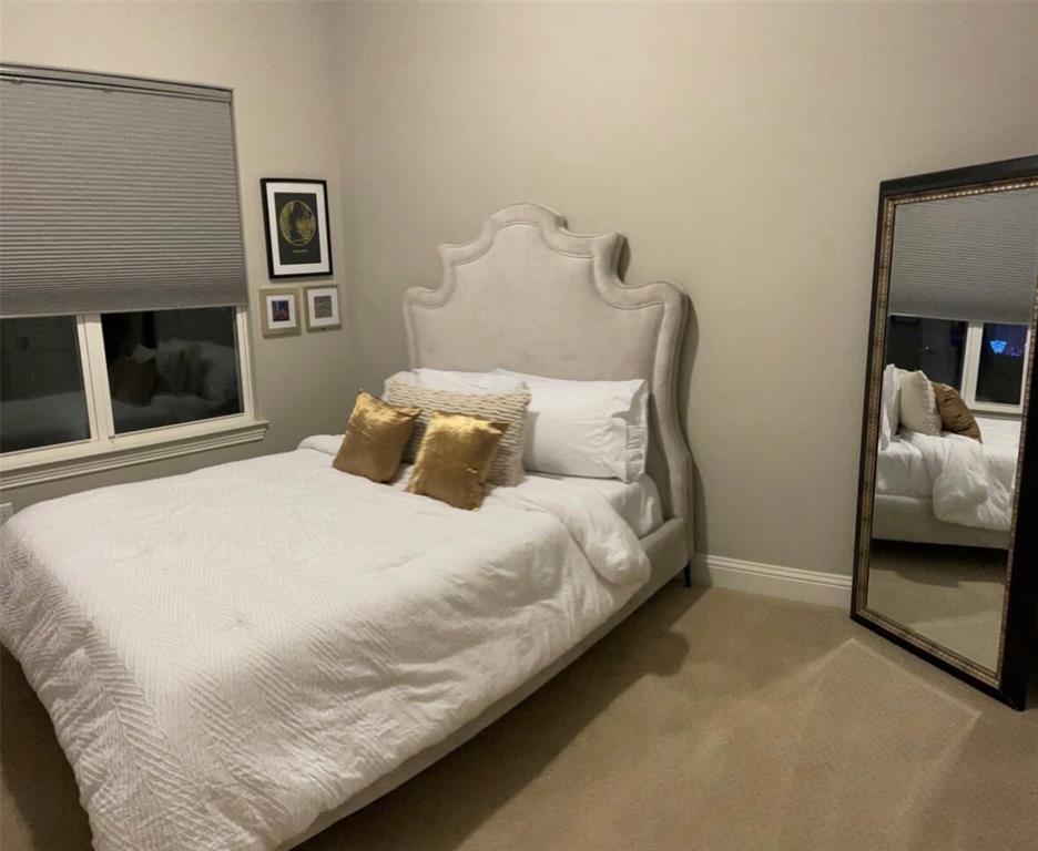 3526 Ivandell Avenue Dallas, TX 75211 - Photo 16 of 17 a bedroom with a bed and a couch