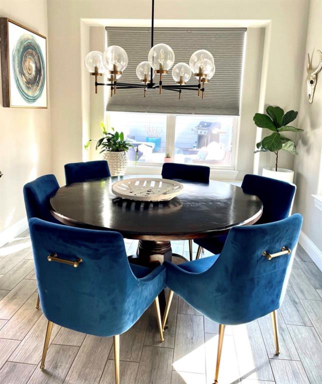 3526 Ivandell Avenue Dallas, TX 75211 - Photo 4 of 17 a living room with dining table and chairs