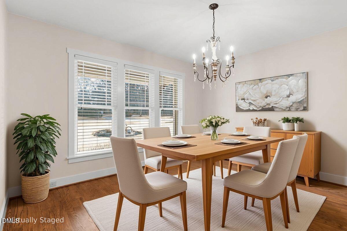 1616 Bowling Road Fuquay-Varina, NC 27526 - Photo 7 of 33 a view of a dining room with furniture window and wooden floor