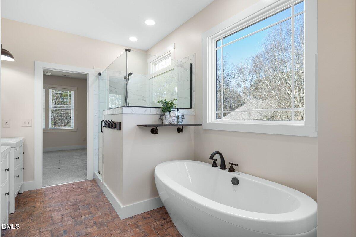 1616 Bowling Road Fuquay-Varina, NC 27526 - Photo 14 of 33 a white bath tub sitting next to a white sink