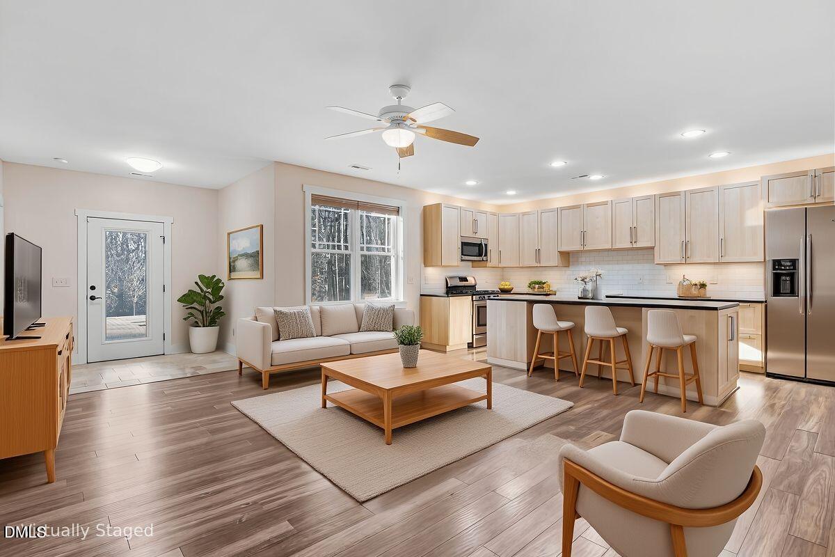 1616 Bowling Road Fuquay-Varina, NC 27526 - Photo 20 of 33 a living room with furniture and kitchen view