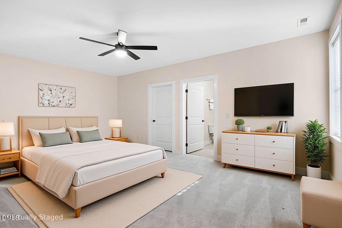 1616 Bowling Road Fuquay-Varina, NC 27526 - Photo 23 of 33 a bedroom with a bed and flat screen tv