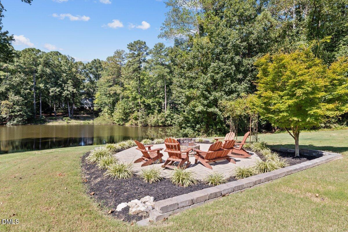 1616 Bowling Road Fuquay-Varina, NC 27526 - Photo 26 of 33 a view of a backyard with table and chairs