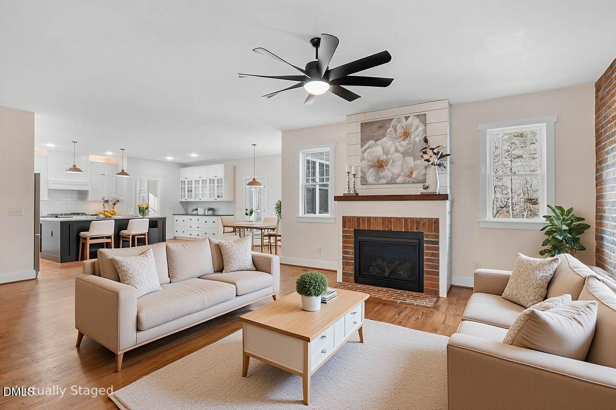 1616 Bowling Road Fuquay-Varina, NC 27526 - Photo 3 of 33 a living room with furniture and a fireplace