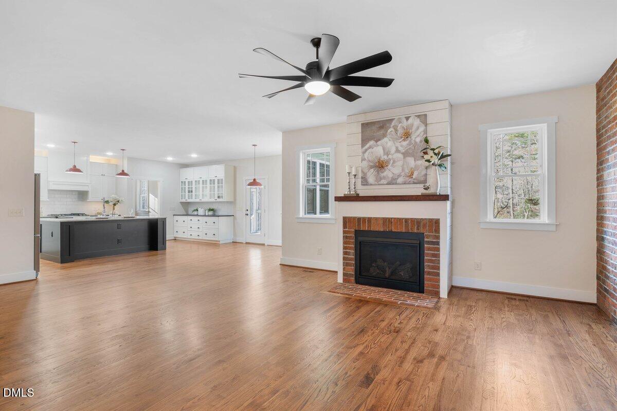 1616 Bowling Road Fuquay-Varina, NC 27526 - Photo 4 of 33 a view of an empty room with a fireplace and a window
