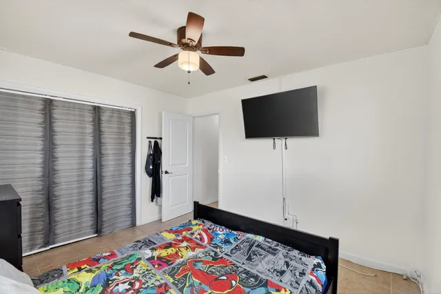 a room with lots of furniture and white walls