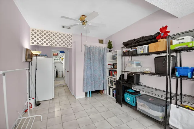 a view of a livingroom with furniture and windows