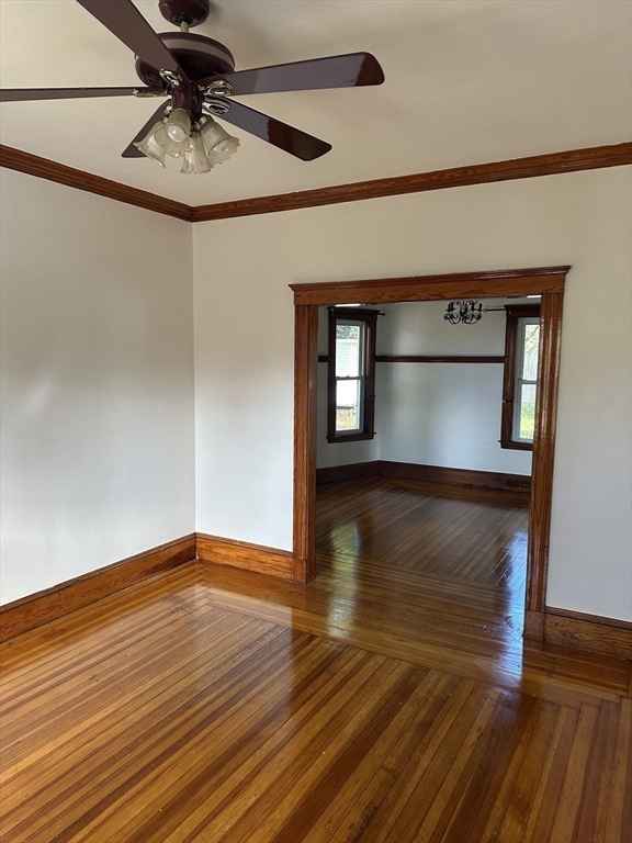 36 Jasper Street Saugus, MA 01906 - Photo 17 of 39 a view of an empty room with wooden floor and a window