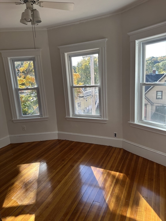 36 Jasper Street Saugus, MA 01906 - Photo 22 of 39 a view of an empty room with wooden floor and a window