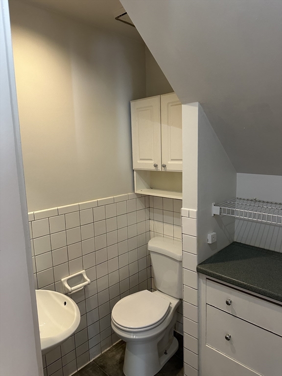 36 Jasper Street Saugus, MA 01906 - Photo 24 of 39 a bathroom with a toilet a sink and mirror