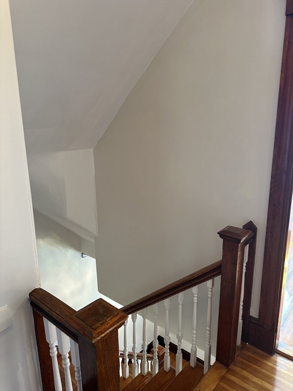 36 Jasper Street Saugus, MA 01906 - Photo 27 of 39 a view of staircase with lots of frames on wall and a window