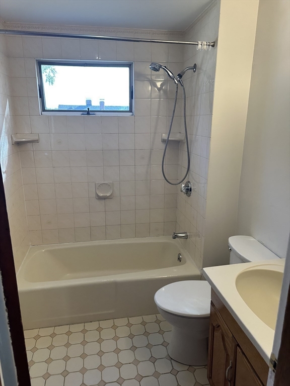 36 Jasper Street Saugus, MA 01906 - Photo 33 of 39 a bathroom with a granite countertop bathtub shower sink and toilet