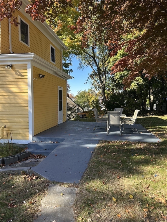 36 Jasper Street Saugus, MA 01906 - Photo 5 of 39 a view of a patio with chair and tables