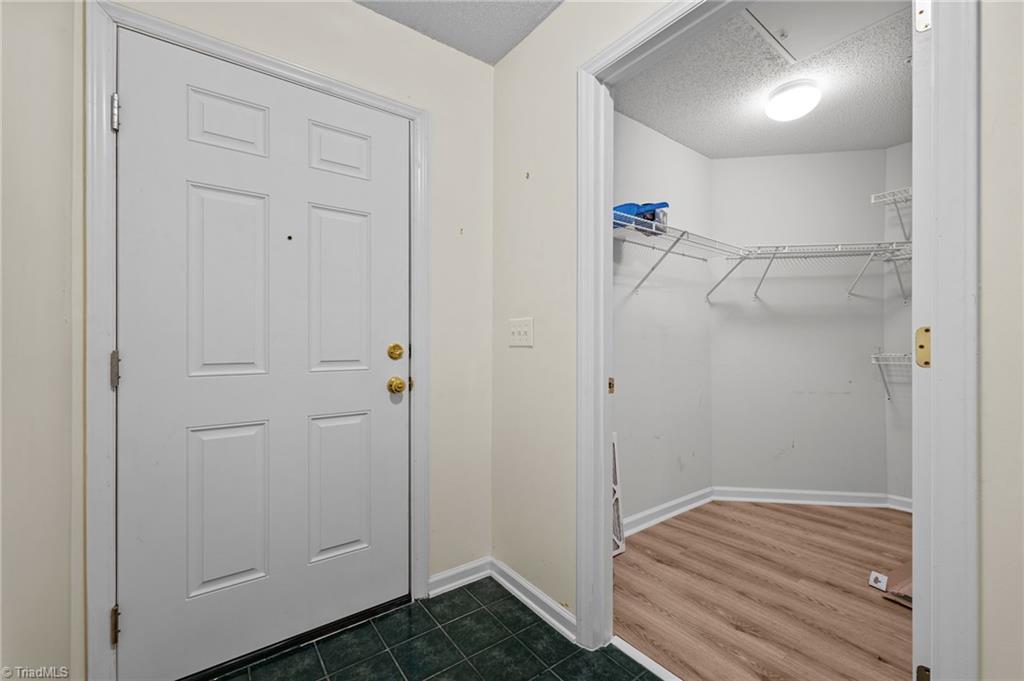 5001 Bass Chapel Road, Unit 3D Greensboro, NC 27455 - Photo 9 of 50 View of front door with a spacious closet.