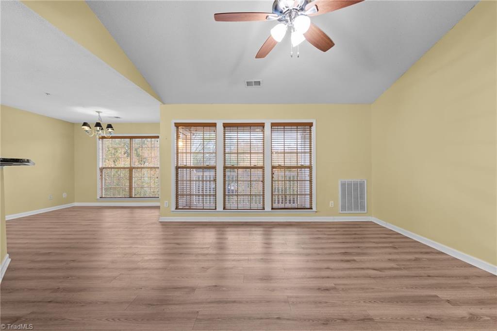 5001 Bass Chapel Road, Unit 3D Greensboro, NC 27455 - Photo 13 of 50 Another view of the living room and dining area.