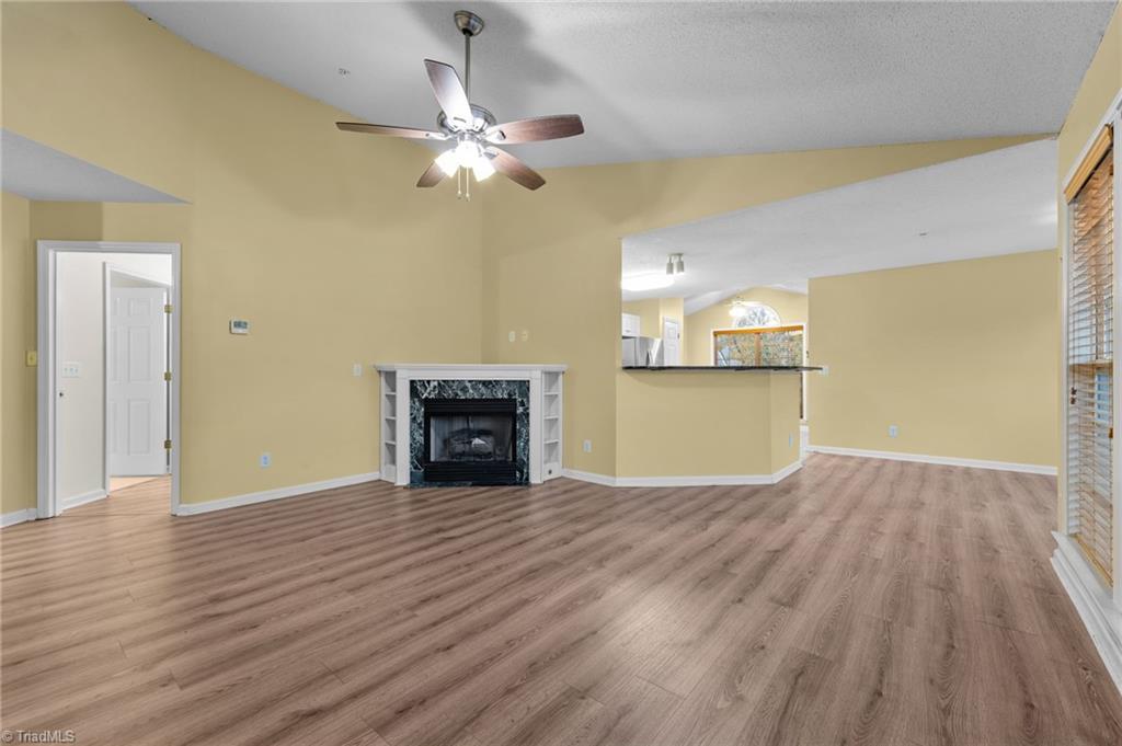 5001 Bass Chapel Road, Unit 3D Greensboro, NC 27455 - Photo 14 of 50 View of living room with fireplace.