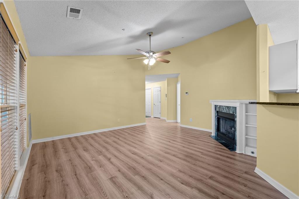 5001 Bass Chapel Road, Unit 3D Greensboro, NC 27455 - Photo 15 of 50 View into living room from the dining area.