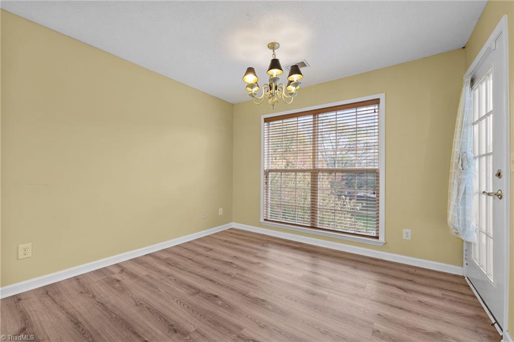 5001 Bass Chapel Road, Unit 3D Greensboro, NC 27455 - Photo 16 of 50 Dining area with access to the private balcony.