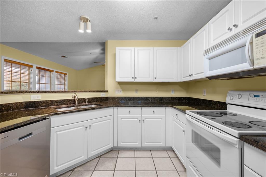 5001 Bass Chapel Road, Unit 3D Greensboro, NC 27455 - Photo 18 of 50 Another view of the kitchen.
