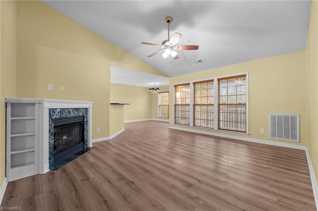 5001 Bass Chapel Road, Unit 3D Greensboro, NC 27455 - Photo 50 of 50 Living room with an open floorplan, leading into the dining area.