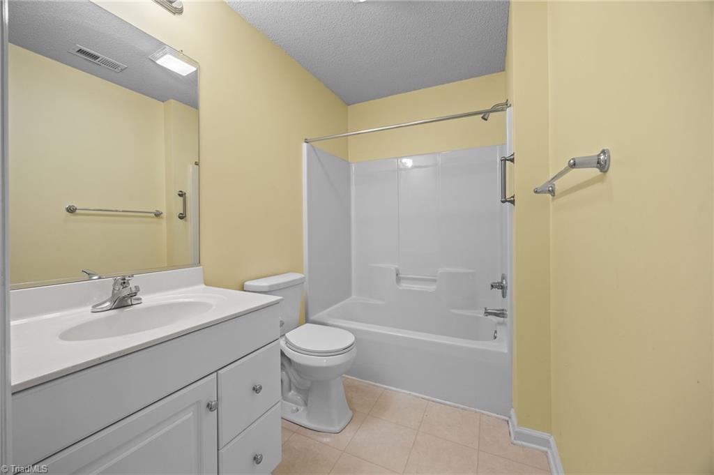 5001 Bass Chapel Road, Unit 3D Greensboro, NC 27455 - Photo 33 of 50 Separate full bathroom with single vanity and shower & tub combo.