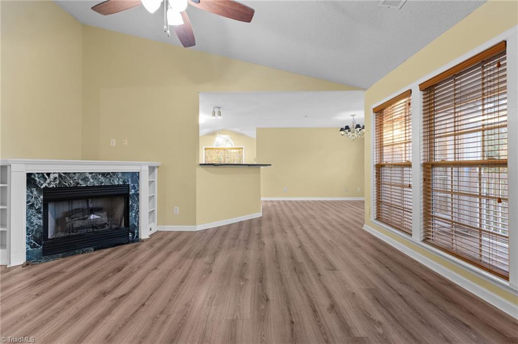 5001 Bass Chapel Road, Unit 3D Greensboro, NC 27455 - Photo 2 of 50 View of living room with fireplace.