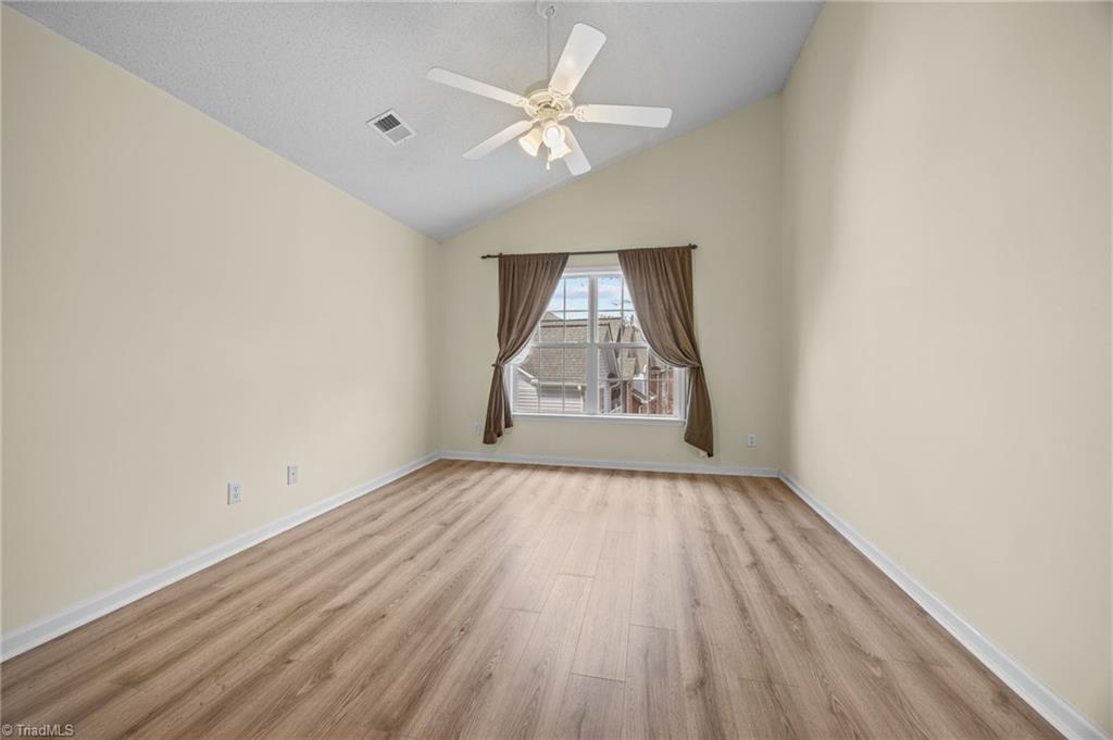 5001 Bass Chapel Road, Unit 3D Greensboro, NC 27455 - Photo 39 of 50 Freshly painted primary bedroom.