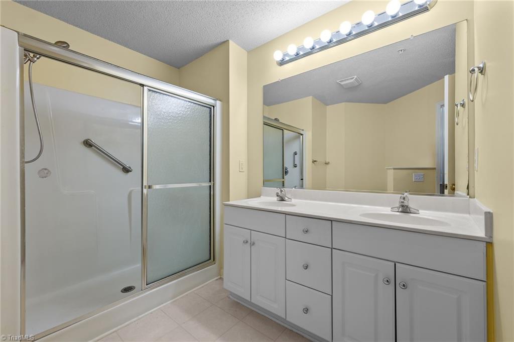 5001 Bass Chapel Road, Unit 3D Greensboro, NC 27455 - Photo 6 of 50 Primary bath with walk-in shower.