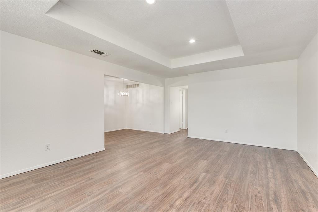 3624 Hulen Park Circle Fort Worth, TX 76123 - Photo 3 of 12 a view of an empty room with wooden floor